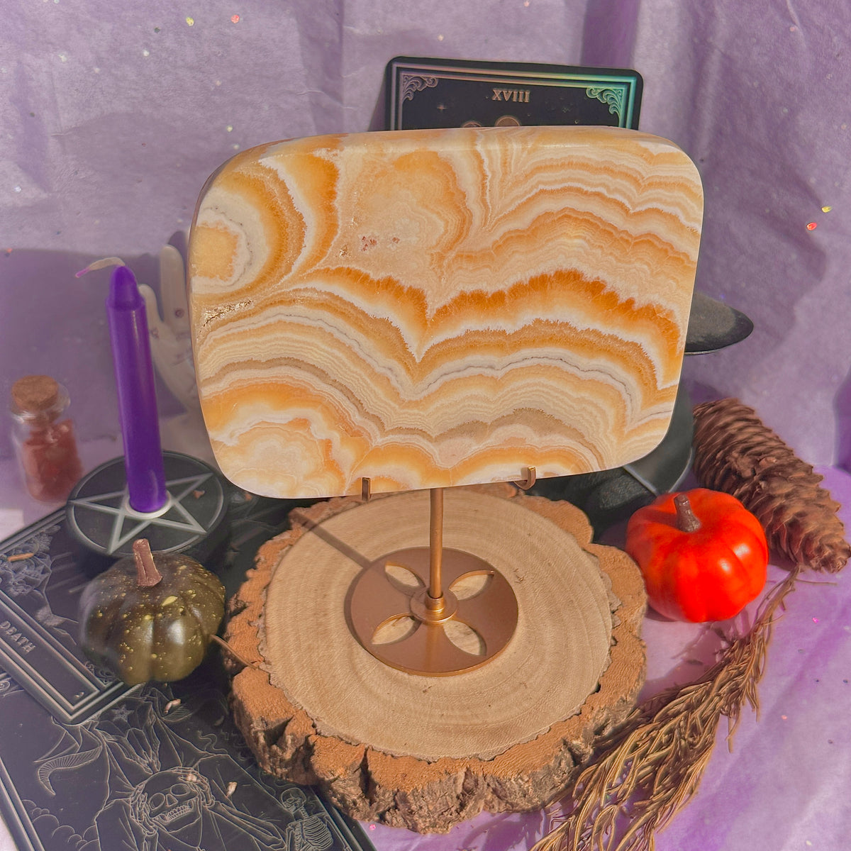 orange calcite slab with stand