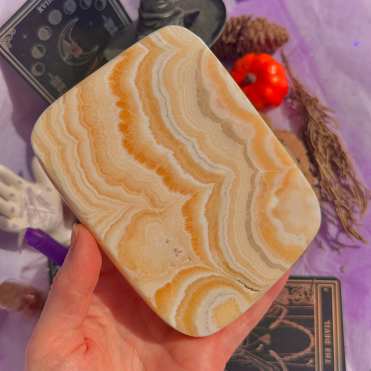 orange calcite slab with stand