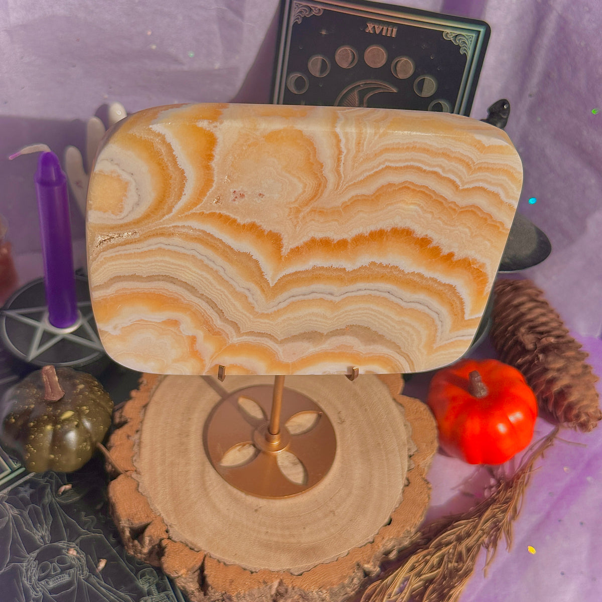 orange calcite slab with stand