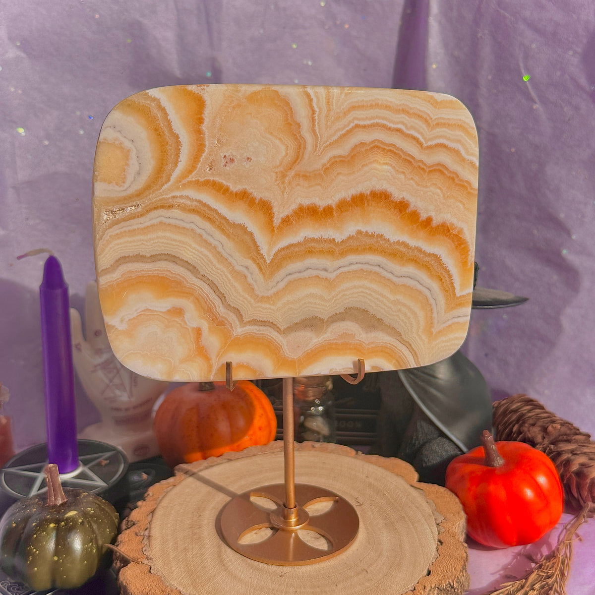 orange calcite slab with stand