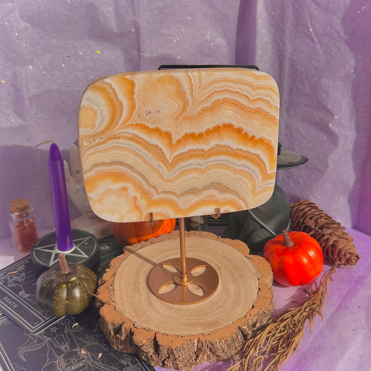 orange calcite slab with stand