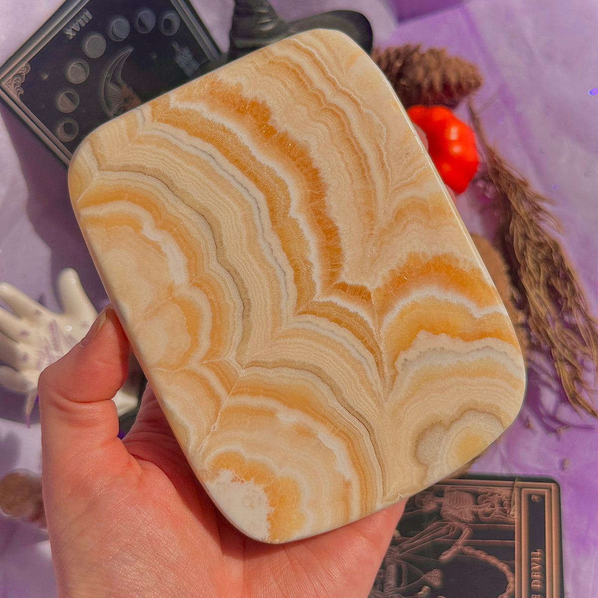 orange calcite slab with stand