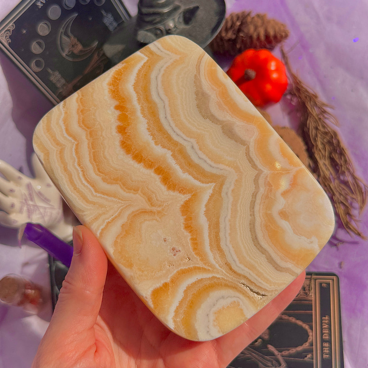orange calcite slab with stand