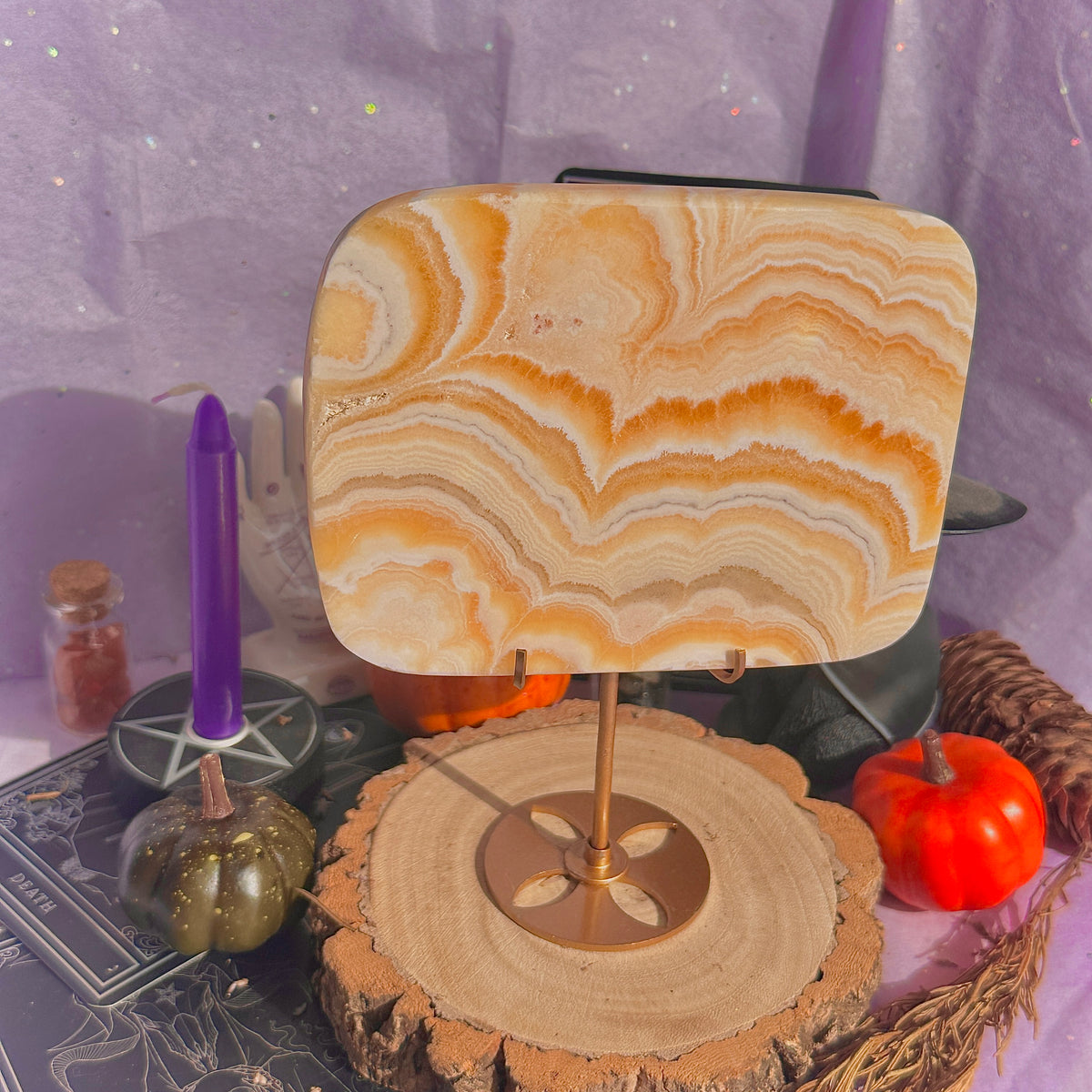 orange calcite slab with stand