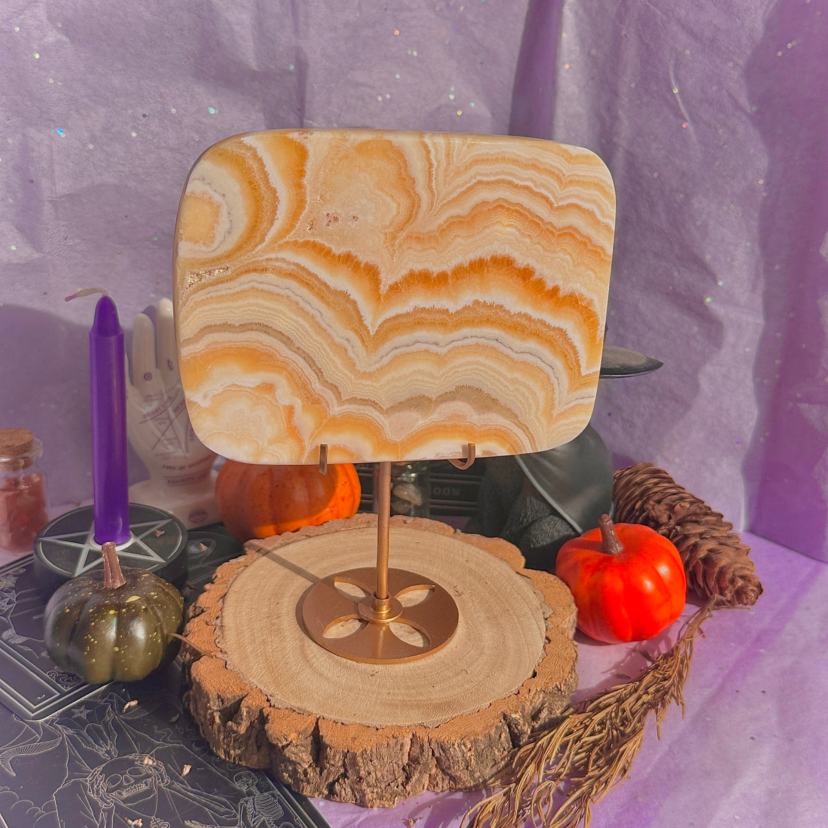 orange calcite slab with stand
