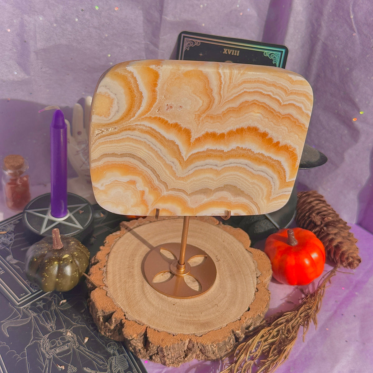 orange calcite slab with stand