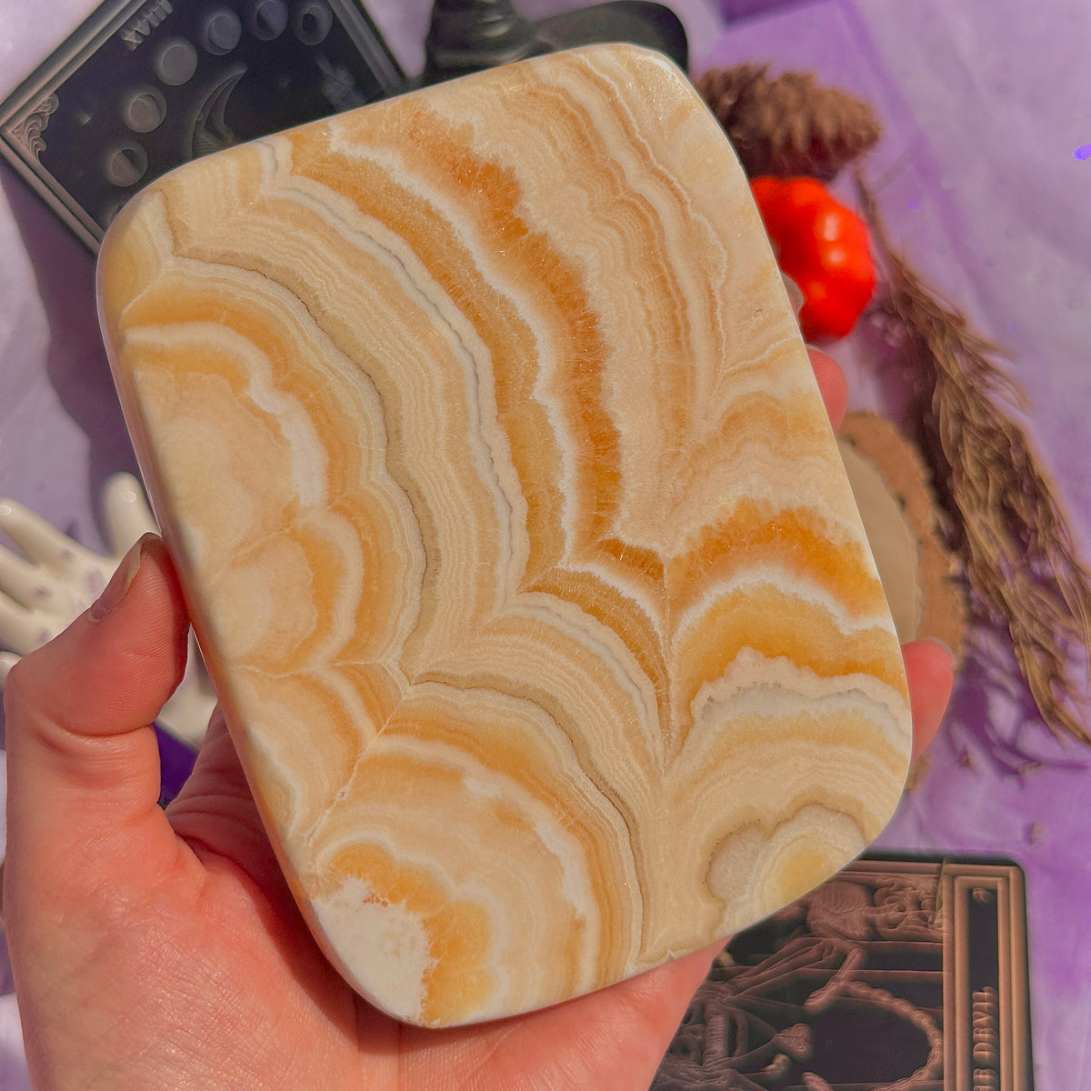 orange calcite slab with stand