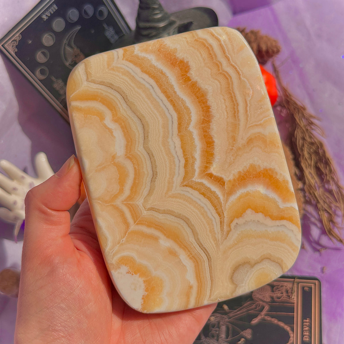 orange calcite slab with stand